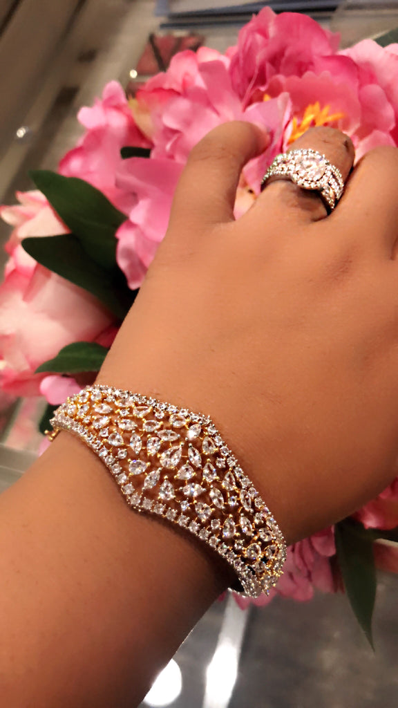 
Complete every look with our intricately handcrafted Sumaya Bracelet. It has the perfect amount of sparkle to add glamour to every look! 

Made with Cubic Zirconia
Jaipur RoseJaipur RoseBraceletsSumaya Statement Bracelet Yellow Gold Plated Luxury Indian Jewelry | J